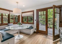 A bright dining room with large windows