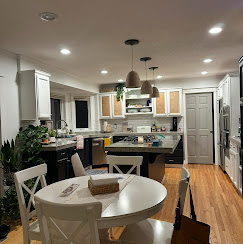 An open-concept remodeled kitchen and dining area